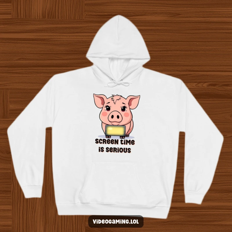 Funny Determined Pig Hoodie, depicted staring intently at a glowing screen, offering warm humor for gamers.
