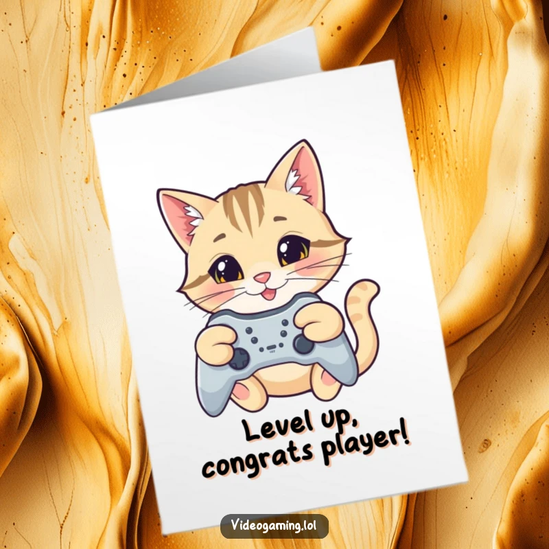Funny Free Printable Congratulations Card: A happy cat celebrating victory, aiming a controller with a focused, triumphant smile.