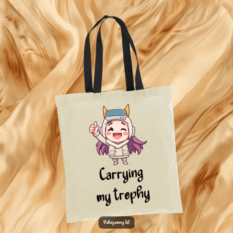 Funny tote bag featuring a happy character celebrating a virtual victory with a fist pump, perfect for carrying essentials.